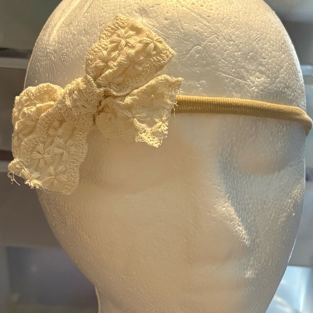 Elegant Cream Headband with Floral Bow